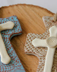 Close up of trinity hanging cross. Handmade hanging cross gift.