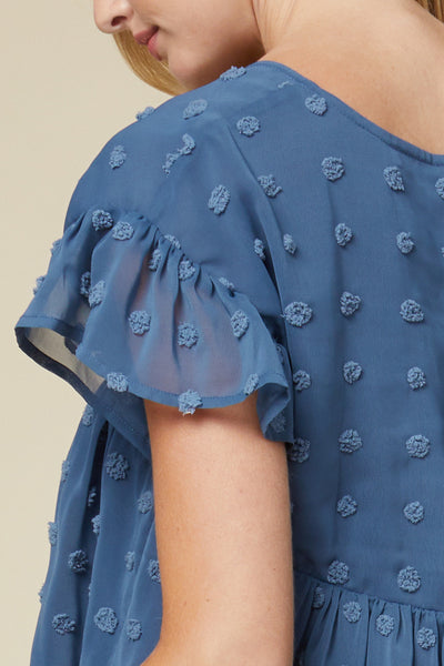 Close up of sleeve on women's lightweight top - blue v-neck with ruffle sleeve