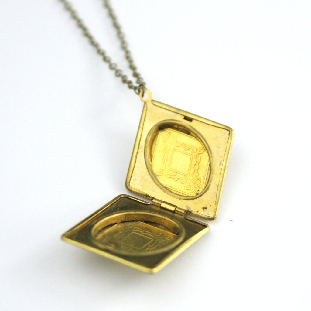 Image of open vintage diamond locket.