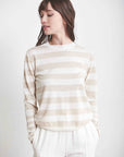 Beautiful light tan and white striped crew neck sweater paired with winter white clacks.