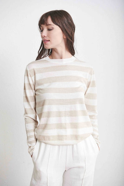 Beautiful light tan and white striped crew neck sweater paired with winter white clacks.