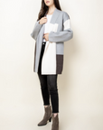 Womens bell sleeve cardigan in full length view.