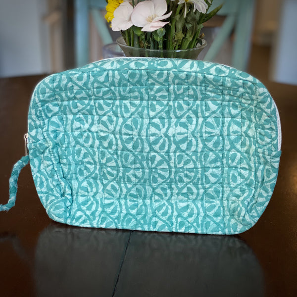 Teal vine patterned travel pouch for women.