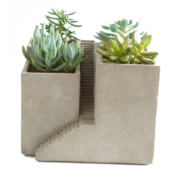 Unique planters and pots. Cement architectural designed pot with three planters.