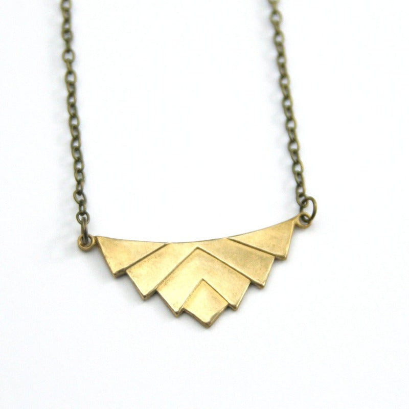 Art deco necklace gold close up.