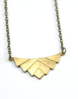 Art deco necklace gold close up.