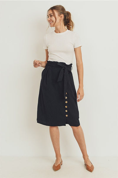 Belted paperbag waist skirt worn by model with white tee.