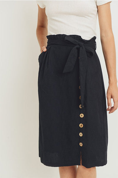 Close up of belted paperbag waist skirt.