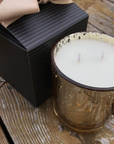 The best gifts that give back are these gold mercury glass candles in their gift box. The mercury glass container can reused after the candle is burned.