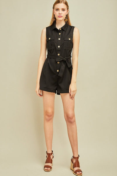 Black shorts romper outfit. Full length view.