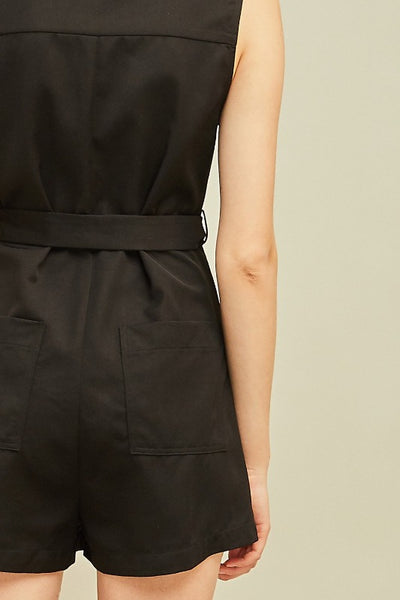 Black shorts romper outfit. Close up of seat.