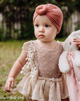 Best Easter Gift for Babies. Baby holding bunny lovey.