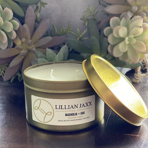 Candles for a good cause. Lillian Jaxx gold tin candle in Magnolia + Oak.