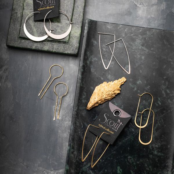 Unique lightweight hoop earrings on display with other scout earrings.