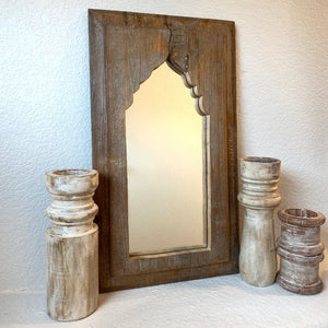 Antique decorative wooden mirror in natural finish.