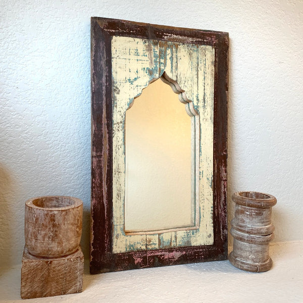 Decorative wooden mirror in two toned finish.