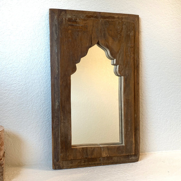 Natural finish decorative wooden mirror.