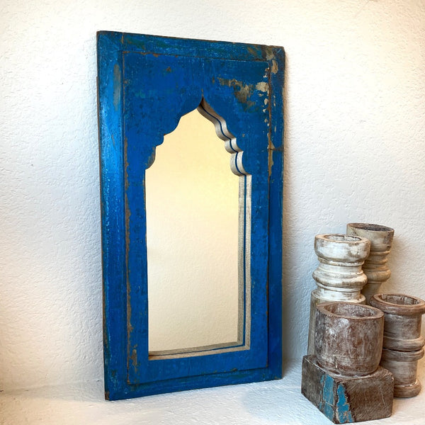 Blue decorative wooden mirror.