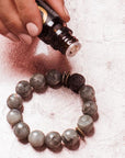 Essential oils diffuser bracelet in use.