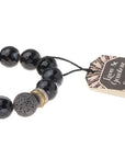 Essential oils diffuser bracelet close up of black agate and lava diffuser bead.