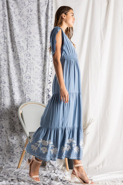 Side view of Women's embroidered maxi dress.