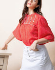 Embroidered bell sleeve blouse.