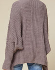 Super soft women's cardigan with textured knit and dolman sleeves.