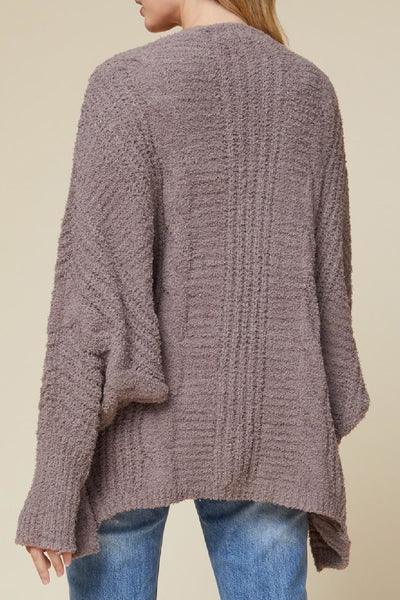 Super soft women's cardigan with textured knit and dolman sleeves.