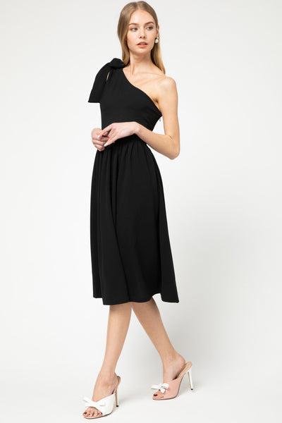 One shoulder, fit and flare knit little black dress in midi length with cute accessories.
