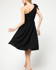 Back view of One shoulder, fit and flare knit little black dress in midi length.