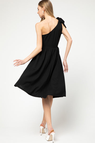 Back view of One shoulder, fit and flare knit little black dress in midi length.