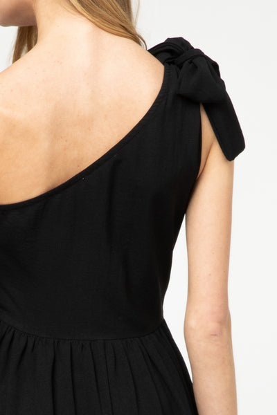 Close up of back view of bodice on one shoulder little black dress.