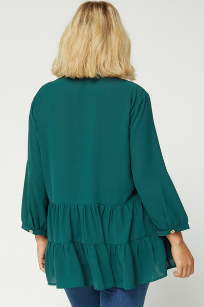 Back view of plus size tiered tunic with 3/4 sleeve and full coverage.