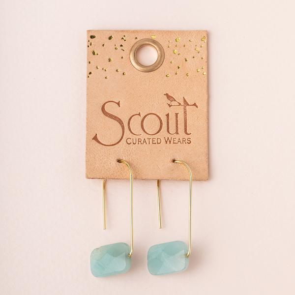 Natural stone drop earrings in amazonite and gold on leather display card.