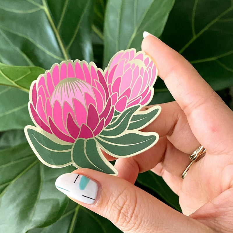 Flower sticker shown being held by model.