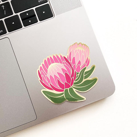 Flower sticker shown on laptop.