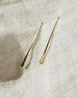 Close up of Minimalist Style Gold Earrings for Women in 14k gold.