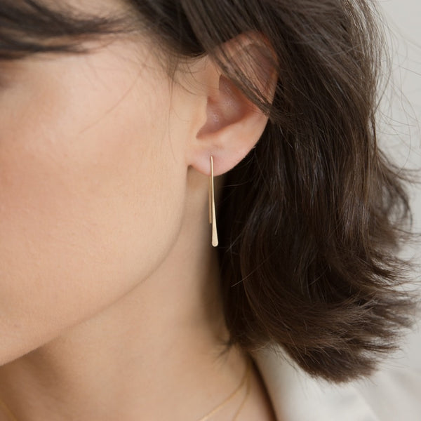 Model wearing Minimalist Style Gold Earrings for Women in hammered ear threads.