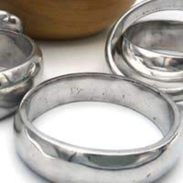 Gifts that give back jewelry. Silver bangle bracelet.