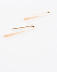 Close up of Minimalist Gold Earrings for Women thin thread.