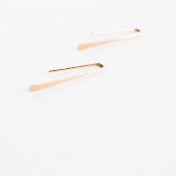Close up of Minimalist Gold Earrings for Women thin thread.