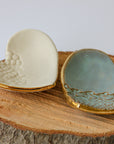 Handmade clay heart ring dish with gold leaf edge detail.