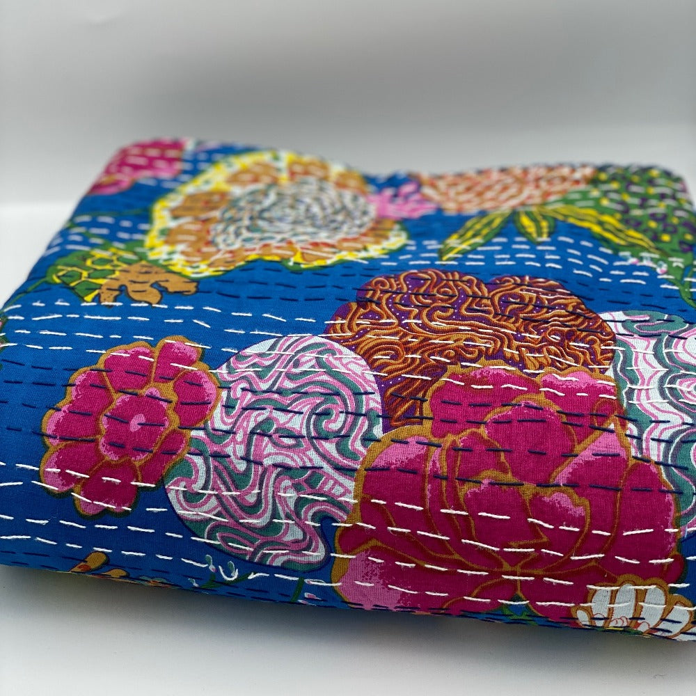 Lightweight queen size quilts in floral pattern.