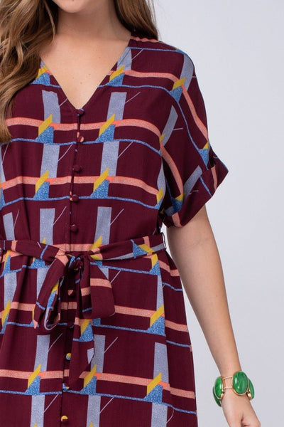 Maroon dress - knee length. Close up view of abstract print.