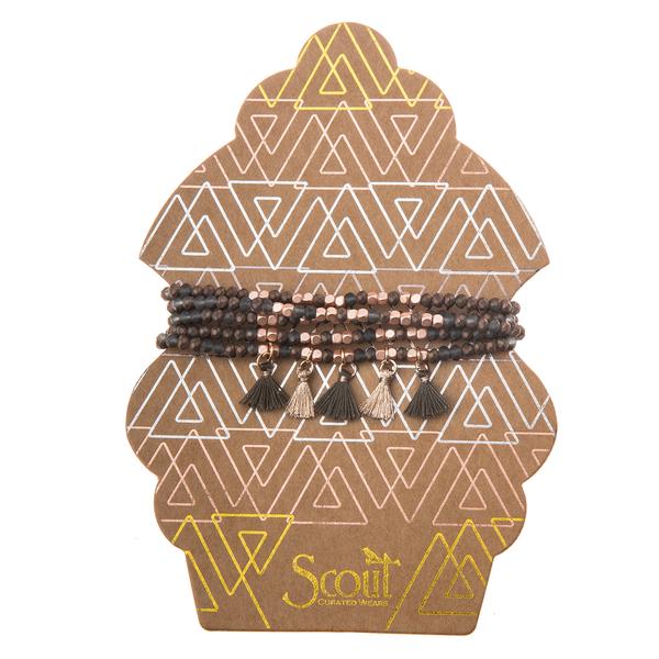 Delicate boho jewelry in bronze and rose gold metallic tassel wrap.