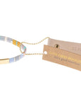 Miyuki bracelets with colorful glass beads in lavender with gold bar and leather reusable tag.