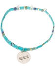 Aqua glass bead bracelet in ocean with sterling silver charm engraved with "breathe".