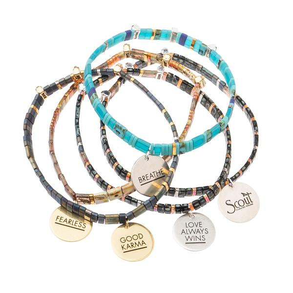 Tortoise shell bracelets. Stack of miyuki bracelets with charm engraved with good intentions.