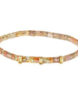 Tortoise shell bracelets with rhinestones and "fearless" embossed gold charm.