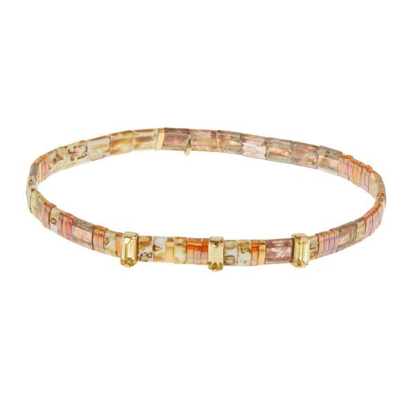 Tortoise shell bracelets with rhinestones and "fearless" embossed gold charm.